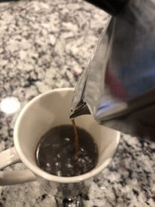 Pouring espresso into my cup